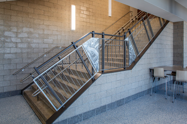 The 333,606-square-foot high school includes the addition of railing infill panels made by Banker Wire, a manufacturer of woven and welded wire mesh for architectural and industrial applications. 