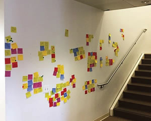 hallway with post it notes on the wall