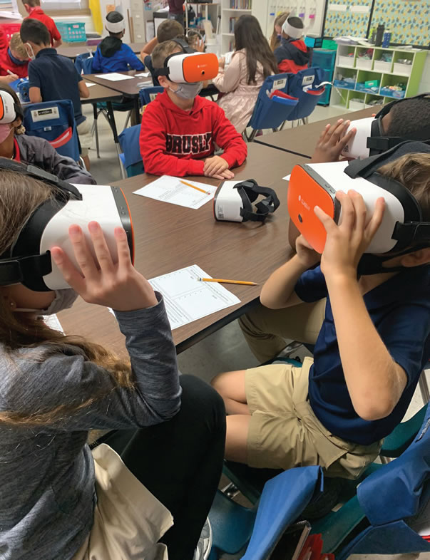 elementary classroom with students wearing VR headsets
