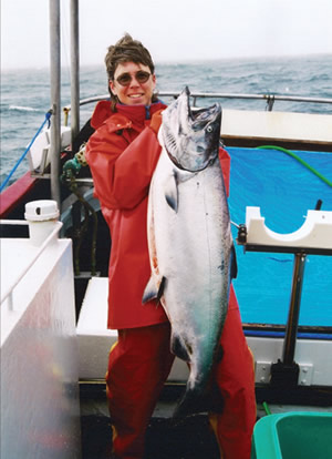 teacher holding large fish