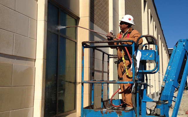 workers on lift cleaning windows