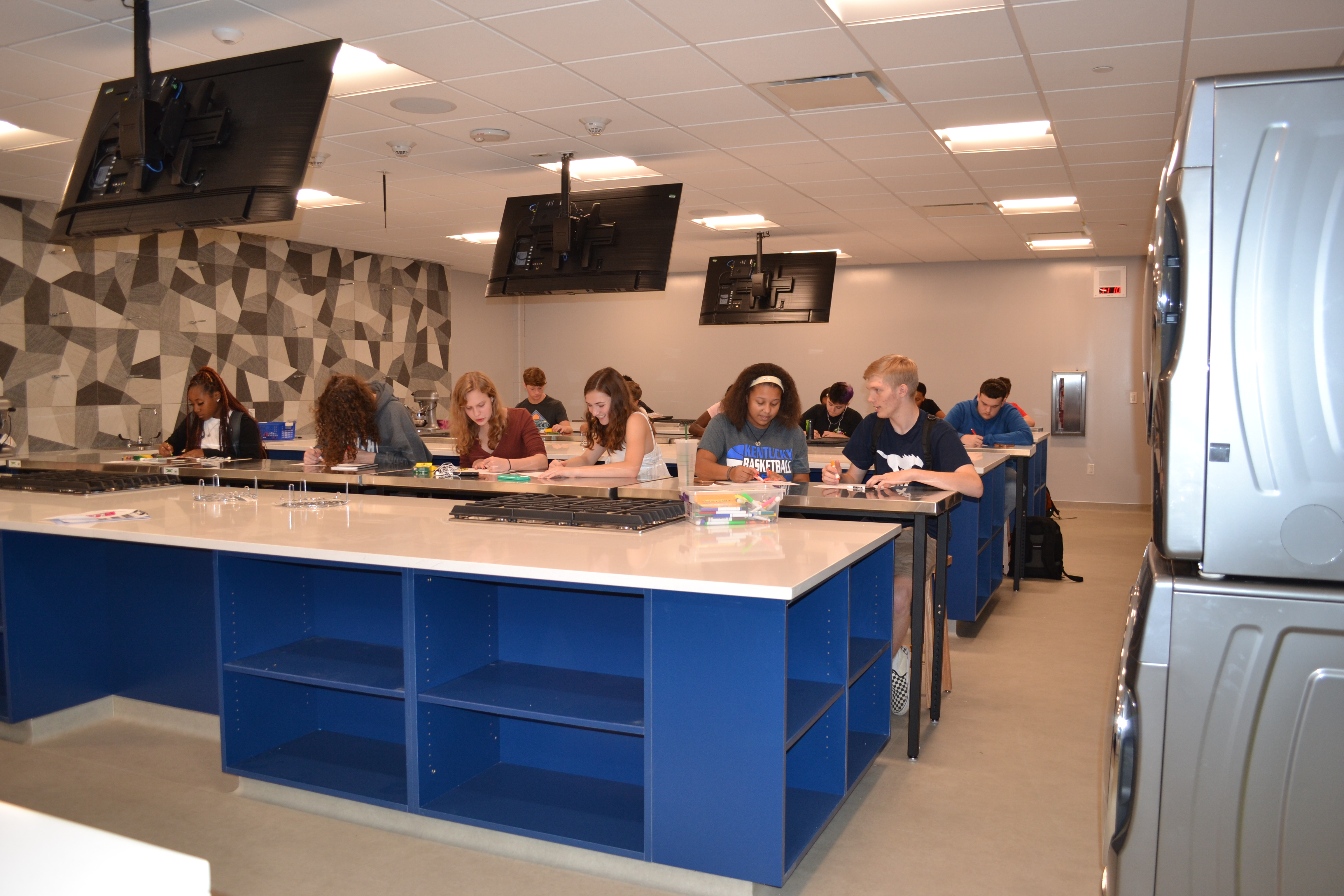 The new culinary lab at Downers Grove South. Each lab contains six large work stations that look like kitchen islands that faces a teacher demonstration station at the head of the class. 