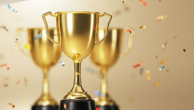 golden trophies with falling confetti